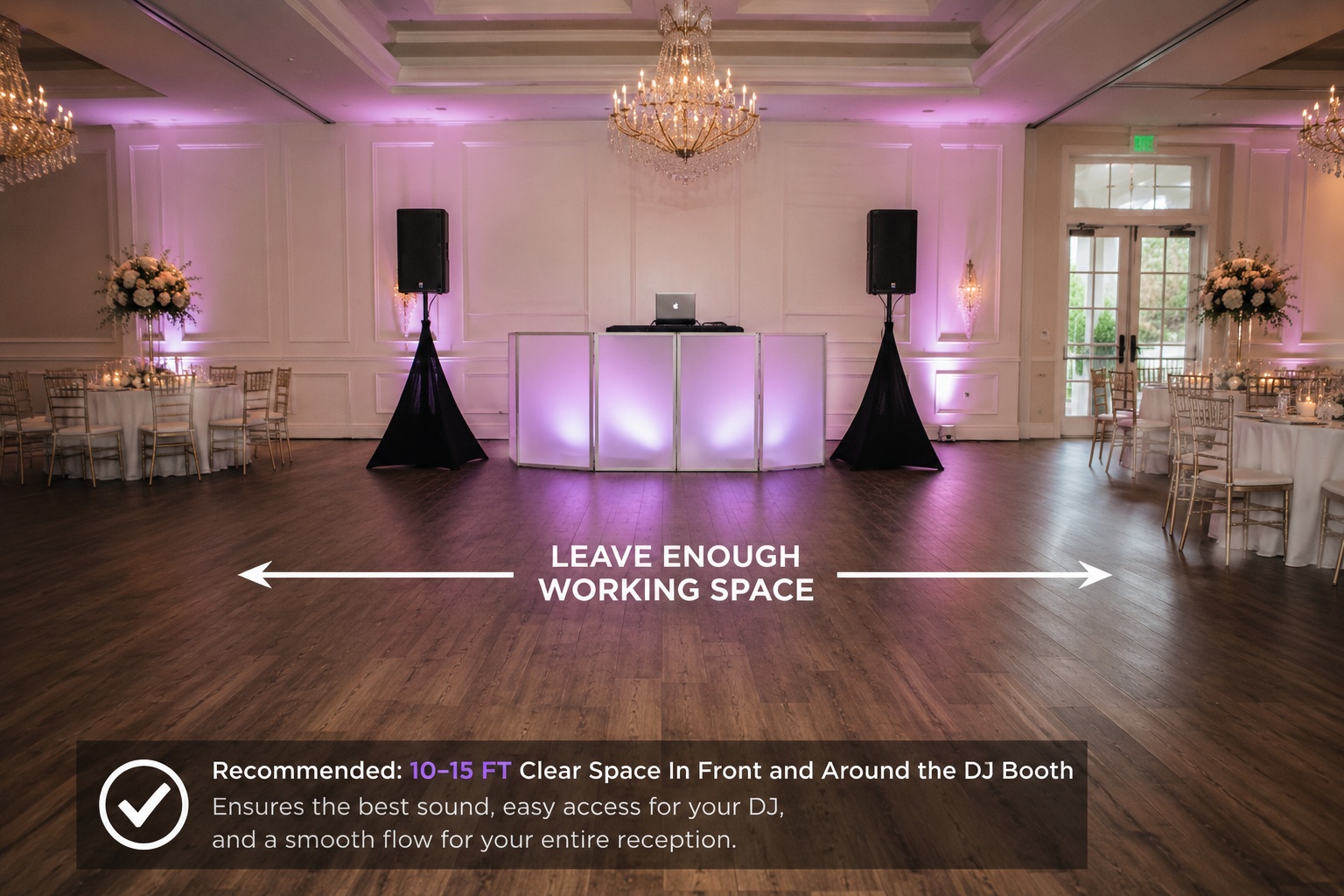 Professional wedding DJ booth with speakers and open working space near the dance floor at an Orlando wedding reception.