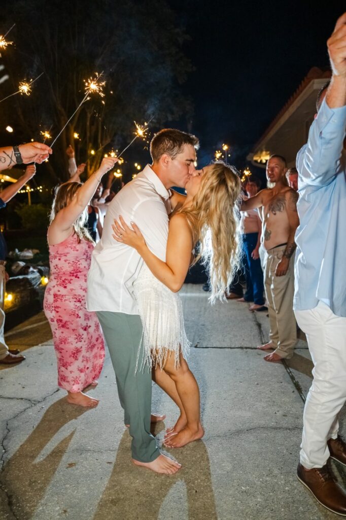 Emily and Aaron walk through their sparkler send off at their Lakeview Gardens wedding