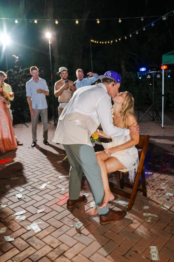 Emily smiles as Aaron performs the surprise One Less Lonely Girl moment during their wedding reception.