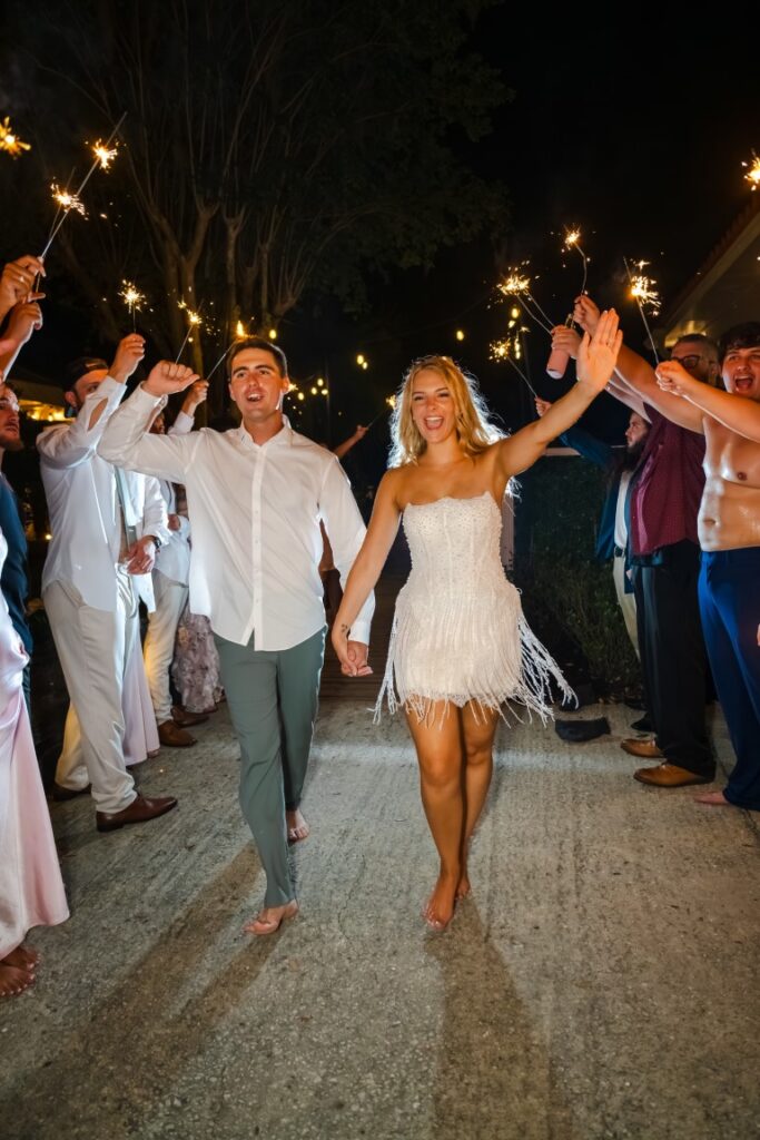 Emily and Aaron walk through their sparkler send off at their Lakeview Gardens wedding