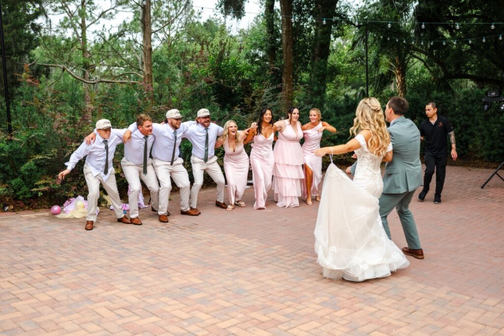 Emily and Aaron's wedding party Swag Surfs during their high-energy Lakeview Gardens reception.
