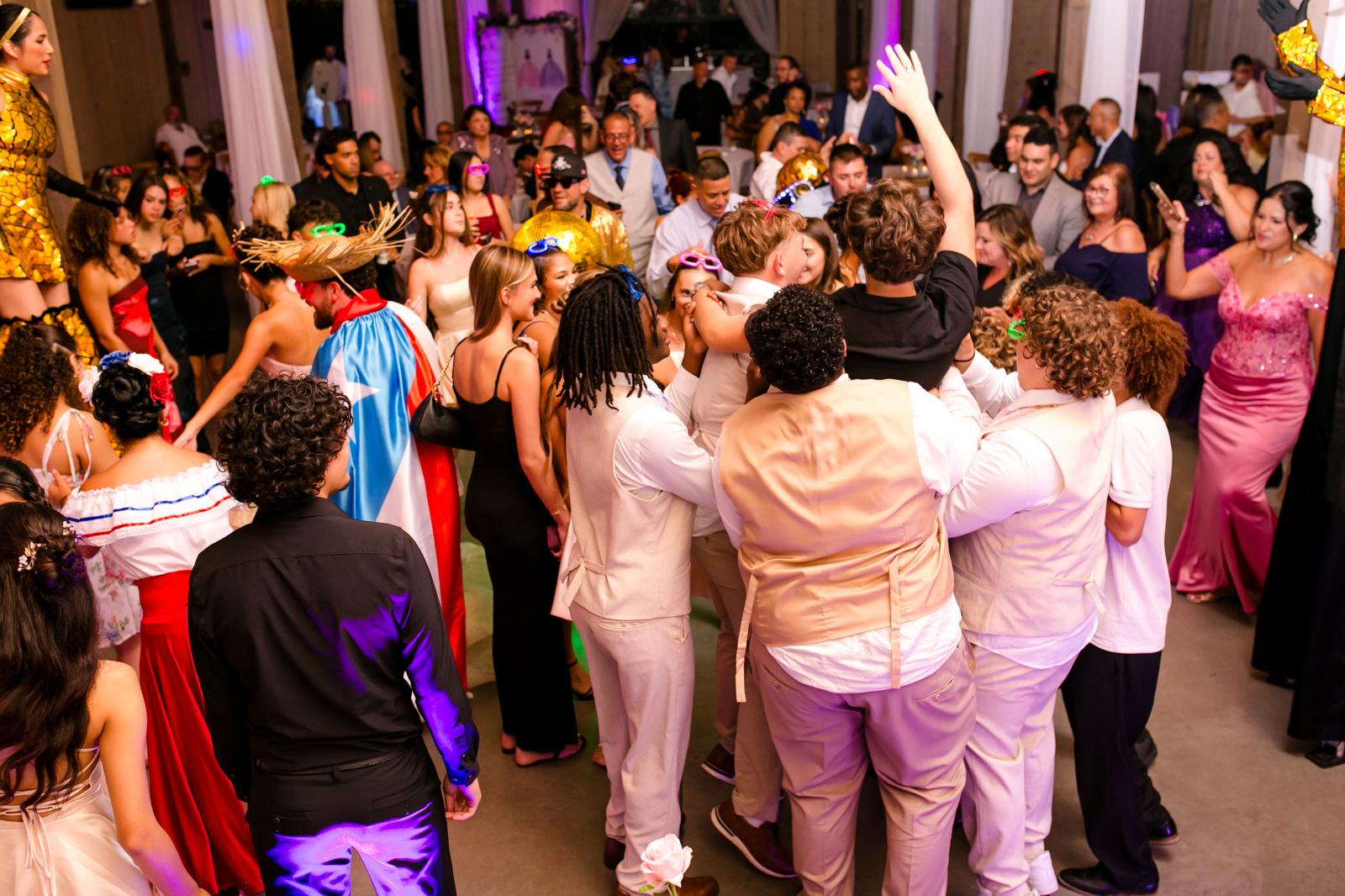 Packed multigenerational dance floor at Alaina and London’s quinceañera in Lake Mary.