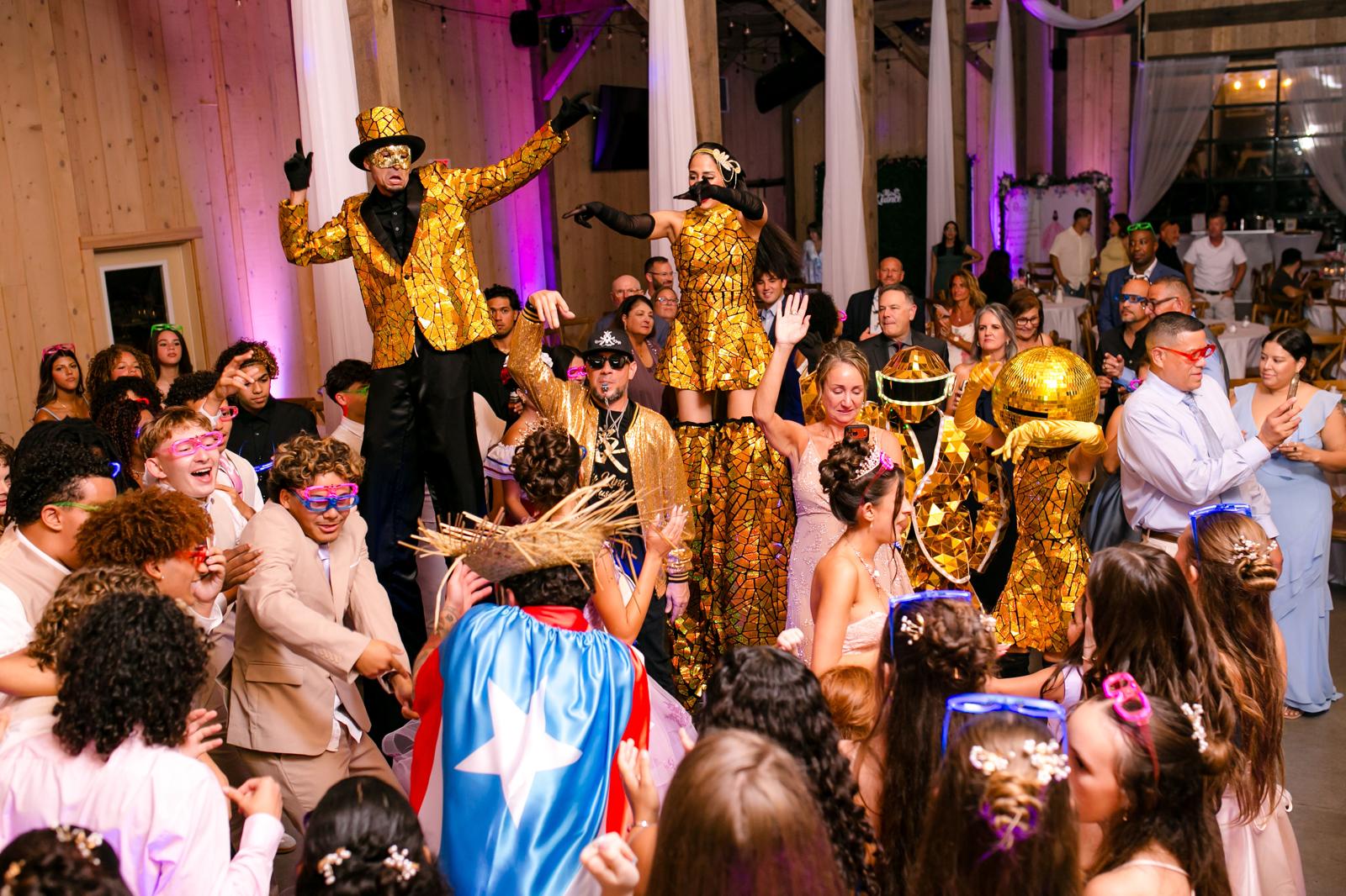 Guests dancing with Hora Loca performers during Alaina and London’s quinceañera.