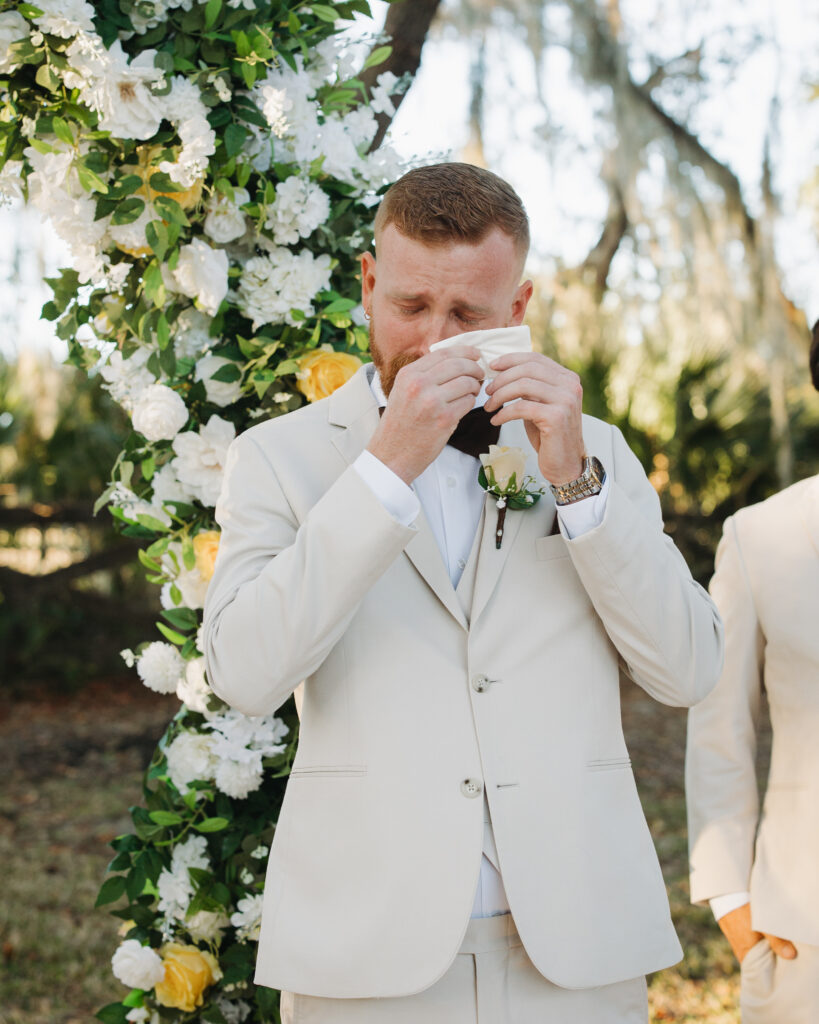 Groom Travis becoming emotional during his wedding ceremony at The Farmhouse on 44.