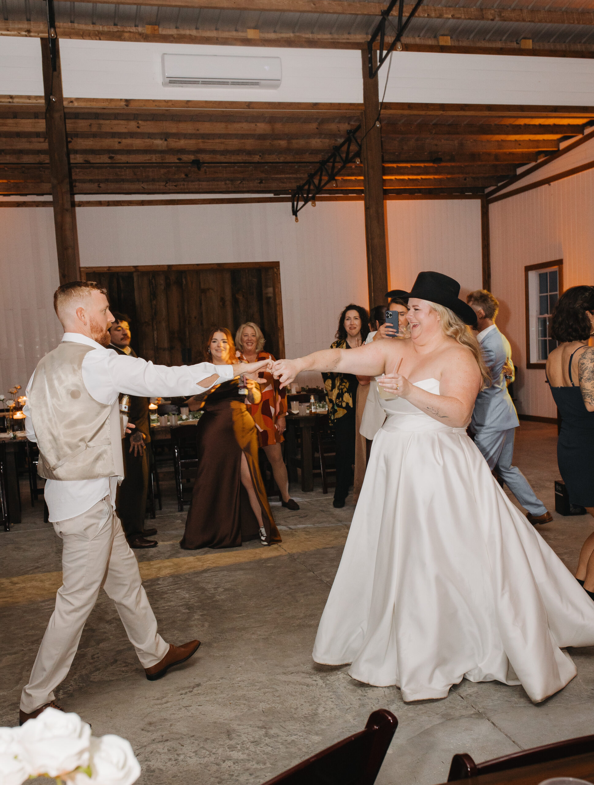 Travis and Sydney dancing together during their wedding reception at The Farmhouse on 44.