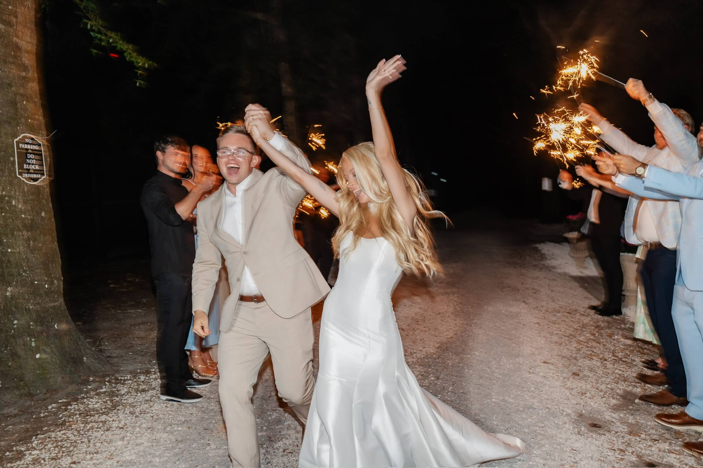 Hannah and Michael celebrating during their sparkler exit