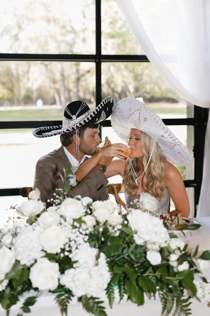 Sierra and Marshall seated together during their wedding reception