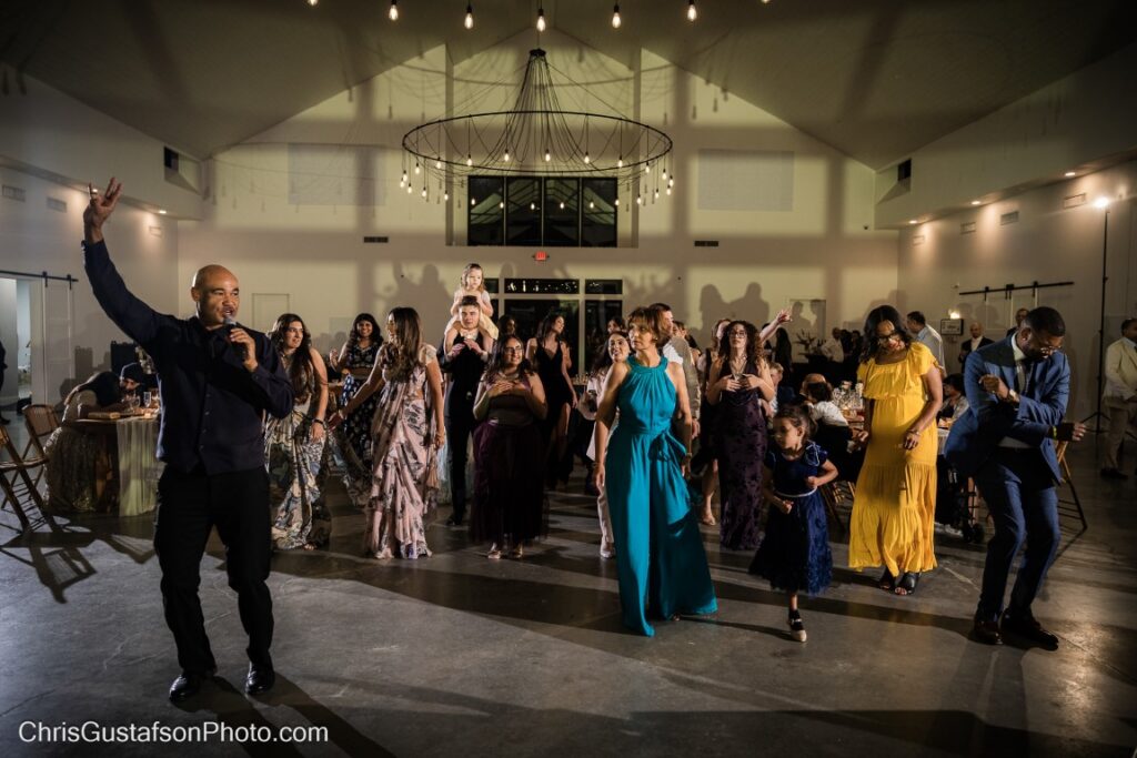 Party Springs DJ leading wedding guests on the dance floor.