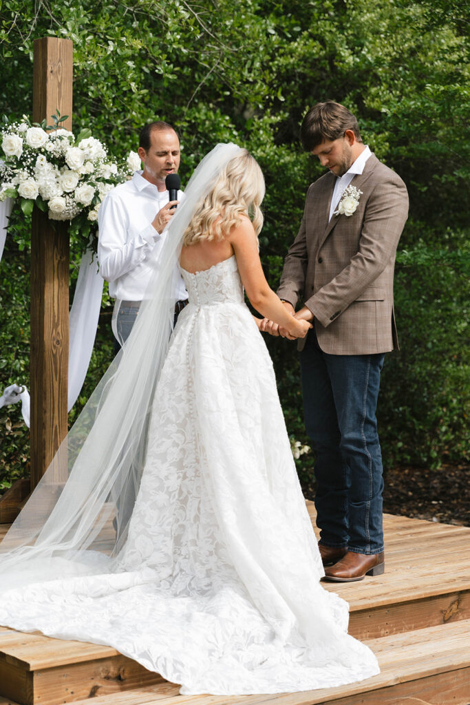 Sierra and Marshall during their outdoor wedding ceremony at The Barn at Hidden Oaks