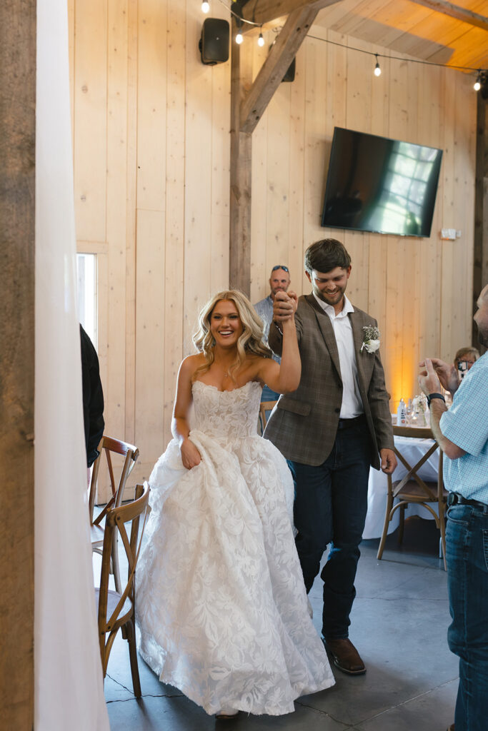 Sierra and Marshall make their wedding reception entrance in Lake Mary