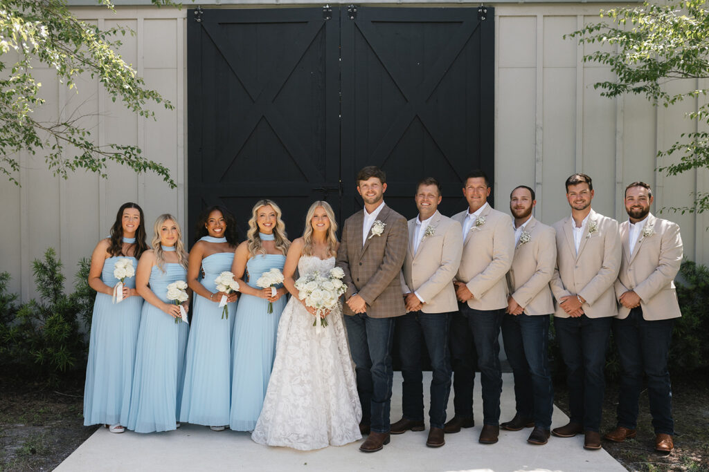 Sierra and Marshall with their wedding party at The Barn at Hidden Oaks